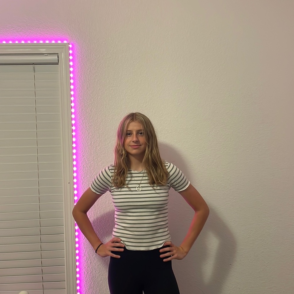 White and gray striped shirt.